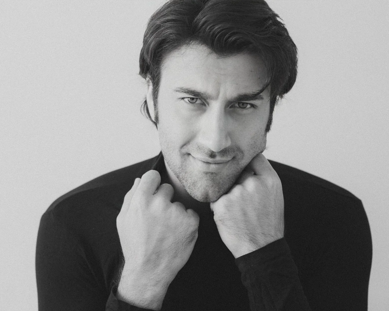 Rohed Khan in a black and white studio portrait